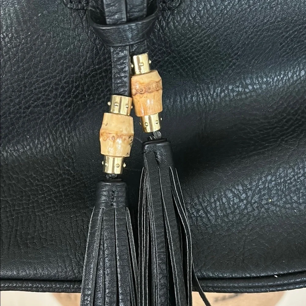 Black Faux Leather Hobo Bag with Tassel Accents